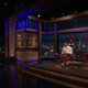 (L-R): Colin Jost, a great deal of empty space, Michael Che, Jimmy Fallon